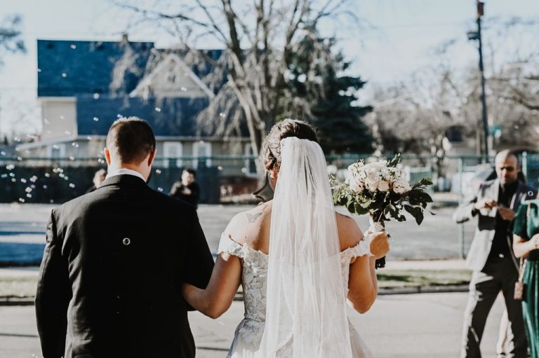 Bride and groom holding hands